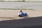 Aaron Yates slides into the gravel